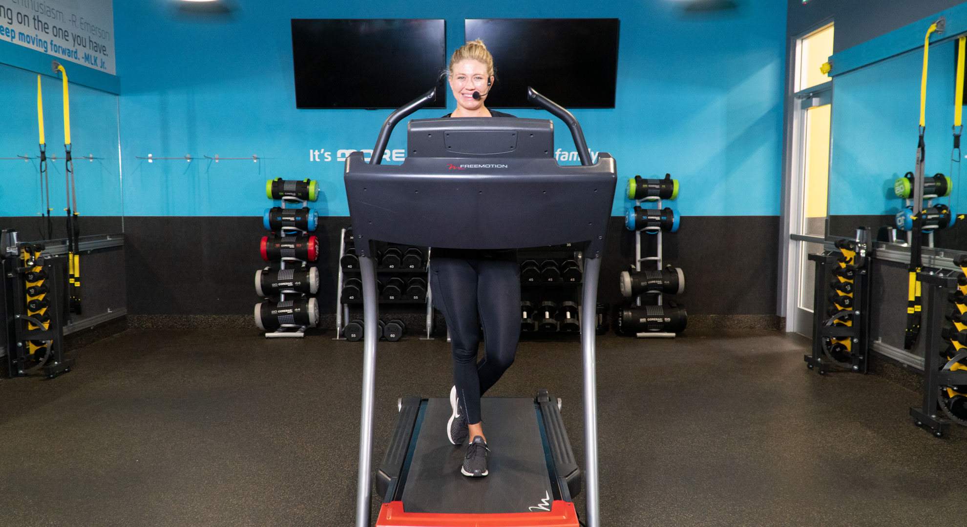 Coach Ashton teaching a treadmill HIIT class on iChuze Fitness