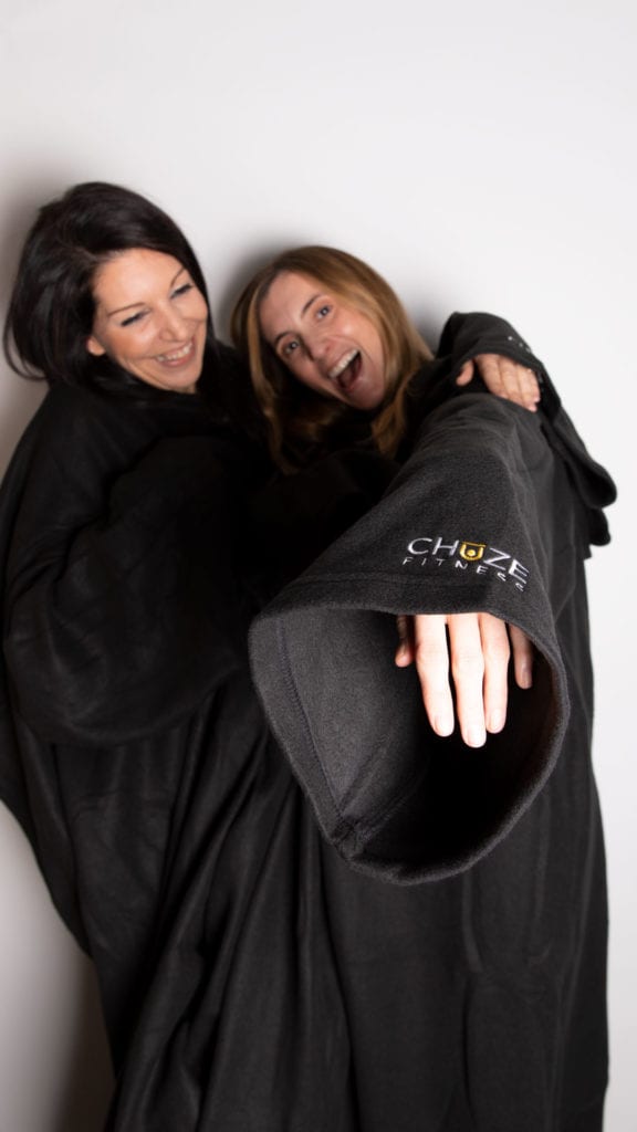 Team Members, Chrissy and Kinsey wearing our date night snuggie giveaways