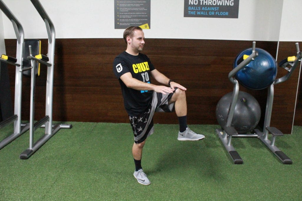 Man showing bodyweight hiit workout high knees