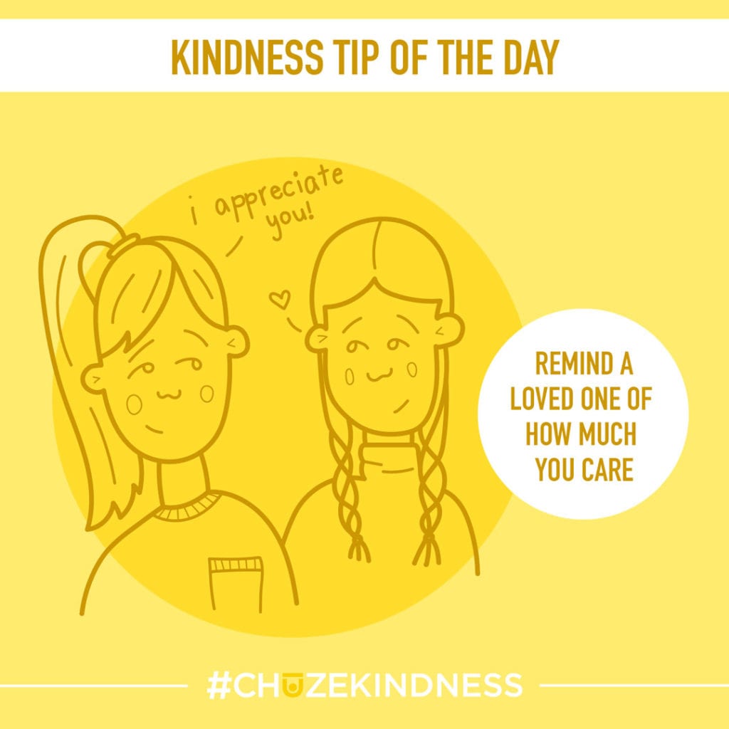 Yellow Kindness Tip Of The Day graphic with an illustration of two girls that says, "Remind a loved one of how much you care."
