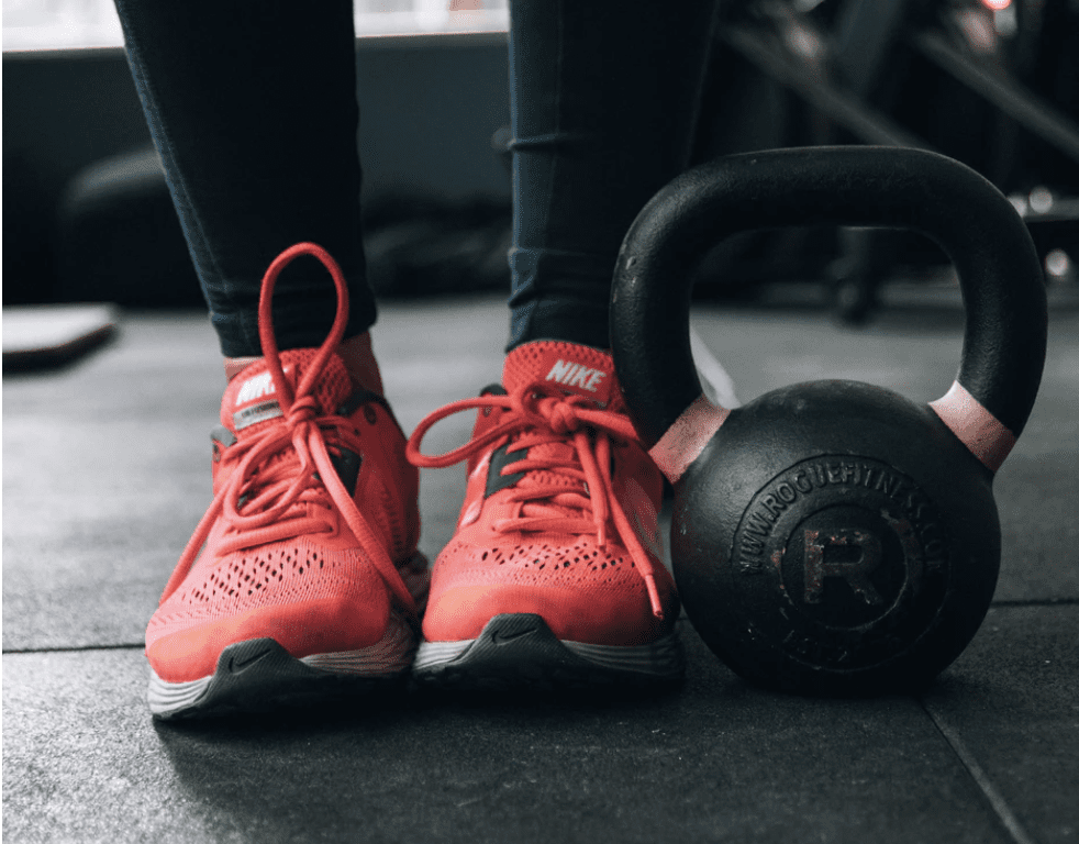 red shoes next to kettlebell for at home gym equipment